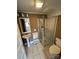 Cozy bathroom featuring a glass-enclosed shower, a classic pedestal sink, and neutral tile flooring at 913 9Th Ne Ave, Hickory, NC 28601