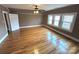 Hardwood floor bedroom with large windows and ceiling fan at 913 9Th Ne Ave, Hickory, NC 28601
