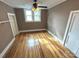 Hardwood floor bedroom with two windows and ceiling fan at 913 9Th Ne Ave, Hickory, NC 28601