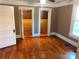 Well-lit bedroom with hardwood floors and double closets at 913 9Th Ne Ave, Hickory, NC 28601