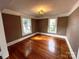 Bright dining room with hardwood floors and built-in shelving at 913 9Th Ne Ave, Hickory, NC 28601