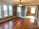Inviting living room featuring hardwood floors, many windows, and a decorative fireplace at 913 9Th Ne Ave, Hickory, NC 28601