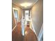 Inviting staircase featuring hardwood steps and a classic white banister, leading to the upper level at 913 9Th Ne Ave, Hickory, NC 28601