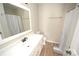 Neutral bathroom with a tub/shower and large mirror over the modern sink at 1008 E Sandy Ridge Rd, Monroe, NC 28112