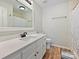 This bright bathroom offers a white vanity with modern fixtures and a shower/tub combo at 1008 E Sandy Ridge Rd, Monroe, NC 28112