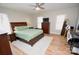 Bright bedroom with a queen bed, dresser, and ceiling fan at 1008 E Sandy Ridge Rd, Monroe, NC 28112