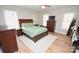 Bright bedroom with a queen bed, dresser, and ceiling fan at 1008 E Sandy Ridge Rd, Monroe, NC 28112