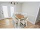 Bright dining area with a wooden table and chairs, adjacent to the kitchen at 1008 E Sandy Ridge Rd, Monroe, NC 28112