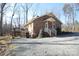 Brick ranch home with a gravel driveway at 1008 E Sandy Ridge Rd, Monroe, NC 28112