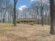 Brick house on a large wooded lot with a covered front porch at 1008 E Sandy Ridge Rd, Monroe, NC 28112