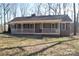 Ranch home with covered porch and large yard at 1008 E Sandy Ridge Rd, Monroe, NC 28112