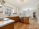 Bright kitchen with stainless steel appliances, white countertops, and a view into the dining area at 1008 E Sandy Ridge Rd, Monroe, NC 28112