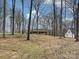 View of a house through bare trees on a spacious lot at 1008 E Sandy Ridge Rd, Monroe, NC 28112