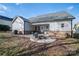 Backyard patio with fire pit and seating area at 102 Lake George Dr, Shelby, NC 28152