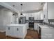 White kitchen with stainless steel appliances and an island at 102 Lake George Dr, Shelby, NC 28152