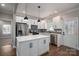 Modern kitchen with white cabinets and a large island at 102 Lake George Dr, Shelby, NC 28152