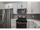 Modern kitchen with stainless steel appliances and white cabinets at 102 Lake George Dr, Shelby, NC 28152