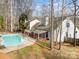 Elevated view of the house, pool, and surrounding trees at 110 Creekside Dr, Fort Mill, SC 29715