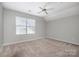 Well-lit bedroom featuring ceiling fan and window with blinds at 110 Creekside Dr, Fort Mill, SC 29715