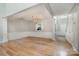 Dining area with hardwood floors, wainscoting, an open floor plan, and a view into the kitchen at 110 Creekside Dr, Fort Mill, SC 29715