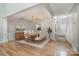 Dining area with hardwood floors, a chandelier, wainscoting, and view into the kitchen at 110 Creekside Dr, Fort Mill, SC 29715