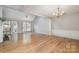 Spacious dining room with hardwood floors, wainscoting, and a chandelier at 110 Creekside Dr, Fort Mill, SC 29715