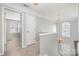 Upstairs hallway with access to bedroom and chandelier at 110 Creekside Dr, Fort Mill, SC 29715