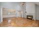 Bright and airy living room with hardwood floors, a fireplace, and high ceilings at 110 Creekside Dr, Fort Mill, SC 29715