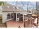 Inviting back exterior featuring a deck and screened-in porch, perfect for outdoor living and entertaining at 110 Creekside Dr, Fort Mill, SC 29715