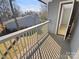 Private balcony overlooking a tree-lined area at 11212 Carmel Chace Dr # 101, Charlotte, NC 28226