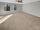 Large bedroom featuring carpet and ample natural light at 11212 Carmel Chace Dr # 101, Charlotte, NC 28226