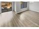 Bright dining room with hardwood floors and sliding glass doors leading to patio at 11212 Carmel Chace Dr # 101, Charlotte, NC 28226