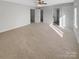 Bright main bedroom with neutral carpeting at 11212 Carmel Chace Dr # 101, Charlotte, NC 28226