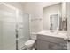 Clean bathroom with gray vanity and glass shower at 12613 Stoneybrook Station Pkwy, Huntersville, NC 28078