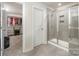 Clean bathroom with a walk-in shower and built-in shelving at 12613 Stoneybrook Station Pkwy, Huntersville, NC 28078