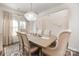 Formal dining room with chandelier and seating for six at 12613 Stoneybrook Station Pkwy, Huntersville, NC 28078