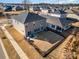 Aerial view of home's exterior, showcasing backyard and patio at 12613 Stoneybrook Station Pkwy, Huntersville, NC 28078