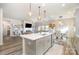 Modern kitchen with gray cabinets, white countertops, and stainless steel appliances at 12613 Stoneybrook Station Pkwy, Huntersville, NC 28078