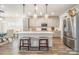 Modern kitchen island with white countertop and gray cabinets at 12613 Stoneybrook Station Pkwy, Huntersville, NC 28078