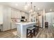 Modern kitchen with gray cabinets and a large island at 12613 Stoneybrook Station Pkwy, Huntersville, NC 28078