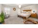 Main bedroom with a king-size bed and a sitting area at 12613 Stoneybrook Station Pkwy, Huntersville, NC 28078