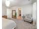 Spacious main bedroom with sitting area and access to walk-in closet at 12613 Stoneybrook Station Pkwy, Huntersville, NC 28078