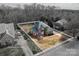 Aerial view of a beautiful home with outlined lot lines, showcasing the property's size and landscaping at 133 Castaway Trl, Mooresville, NC 28117