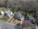 Aerial view of the home showcasing the property's layout and neighborhood, including a spacious backyard and lush greenery at 133 Castaway Trl, Mooresville, NC 28117