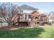 Spacious back deck perfect for outdoor dining and entertaining, featuring stairs to the backyard and grilling area at 133 Castaway Trl, Mooresville, NC 28117