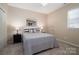 Cozy bedroom with carpeted floors features neutral paint and great natural light at 133 Castaway Trl, Mooresville, NC 28117