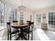 Eat-in kitchen features multiple windows and light-filled breakfast nook seating at 133 Castaway Trl, Mooresville, NC 28117