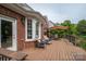 Spacious wooden deck with outdoor seating, perfect for entertaining with a view of the lush backyard at 133 Castaway Trl, Mooresville, NC 28117