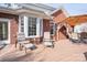 Deck area with patio furniture and a brick house as a backdrop at 133 Castaway Trl, Mooresville, NC 28117