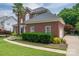 A charming brick home featuring well-maintained landscaping and a manicured lawn at 133 Castaway Trl, Mooresville, NC 28117